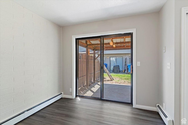 190 W 1100 N, Logan, UT 84341 - unfurnished room featuring a baseboard radiator, dark wood-style flooring, and baseboards