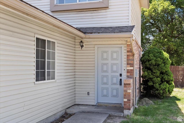 190 W 1100 N, Logan, UT 84341 - doorway to property featuring roof with shingles