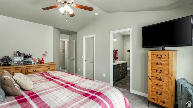 1026 E Searle Ln, Eagle Mountain, UT 84005 - carpeted bedroom featuring vaulted ceiling, baseboards, connected bathroom, and a ceiling fan