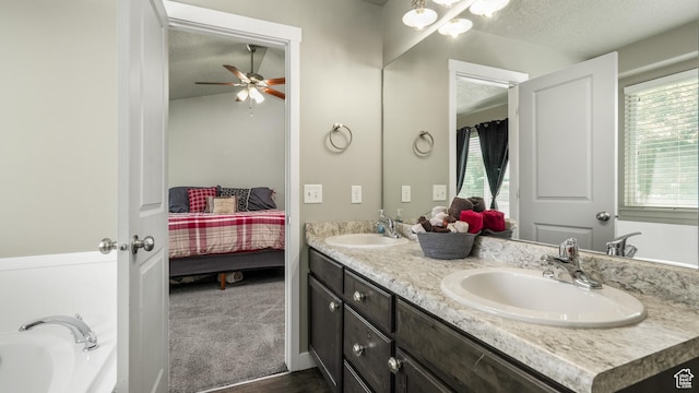 1026 E Searle Ln, Eagle Mountain, UT 84005 - ensuite bathroom with a textured ceiling, double vanity, ceiling fan, and a tub to relax in
