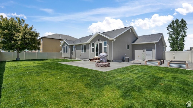 1026 E Searle Ln, Eagle Mountain, UT 84005 - back of property featuring a patio, central AC unit, a vegetable garden, and stucco siding