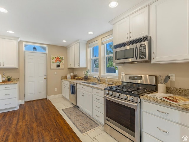 932 W 600 N, Salt Lake City, UT 84116 - kitchen featuring appliances with stainless steel finishes, a sink, white cabinets, light stone countertops, and recessed lighting