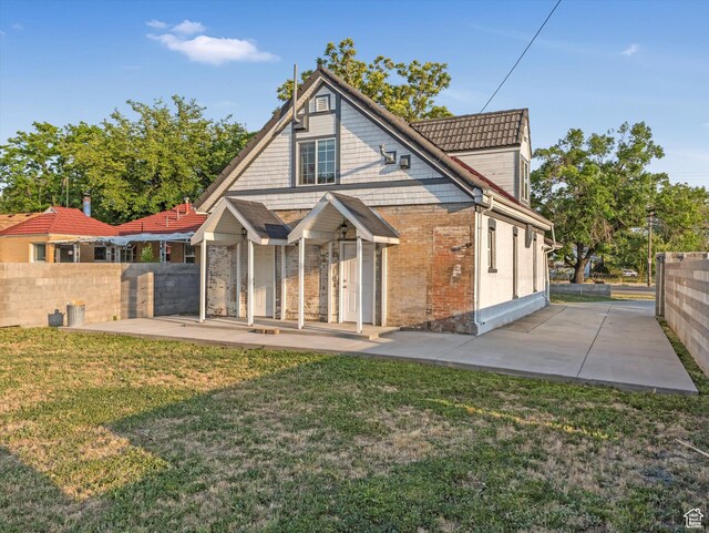 932 W 600 N, Salt Lake City, UT 84116 - back of property with a patio and brick siding