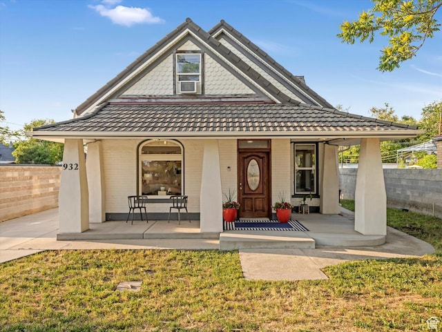 932 W 600 N, Salt Lake City, UT 84116 - victorian house featuring covered porch, cooling unit, and brick siding