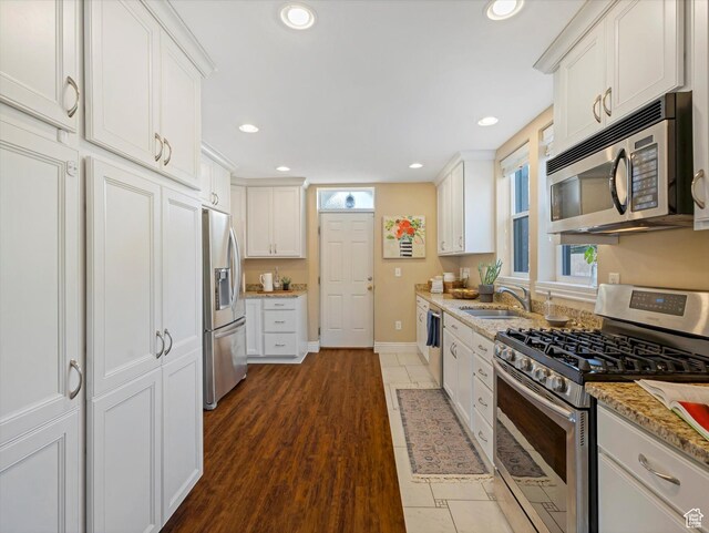 932 W 600 N, Salt Lake City, UT 84116 - kitchen featuring stainless steel appliances, a sink, white cabinets, recessed lighting, and baseboards