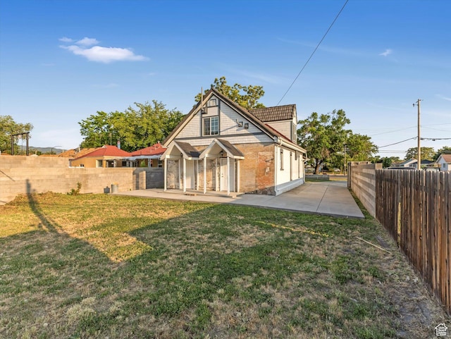 932 W 600 N, Salt Lake City, UT 84116 - rear view of property with a patio area and brick siding