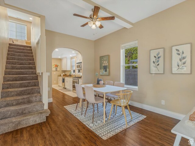 932 W 600 N, Salt Lake City, UT 84116 - dining area featuring arched walkways, wood finished floors, ceiling fan, stairway, and baseboards