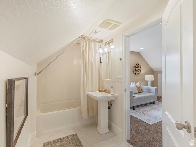932 W 600 N, Salt Lake City, UT 84116 - ensuite bathroom with shower / bath combo with shower curtain, vaulted ceiling, a textured ceiling, baseboards, and marble finish flooring