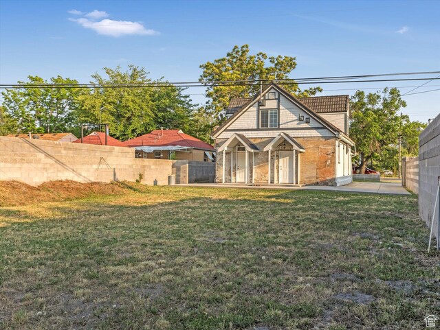 932 W 600 N, Salt Lake City, UT 84116 - rear view of house with a patio area and brick siding