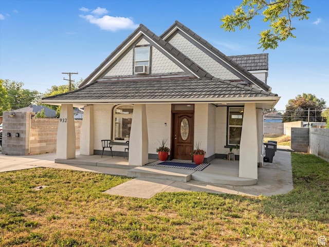 932 W 600 N, Salt Lake City, UT 84116 - view of front of property featuring a porch, cooling unit, and brick siding