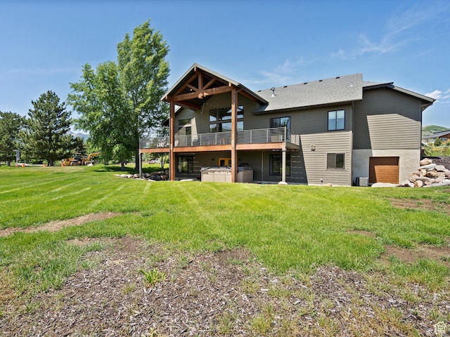 4021 E 4325 N, Eden, UT 84310 - back of house with a hot tub, a lawn, a deck, and a shingled roof