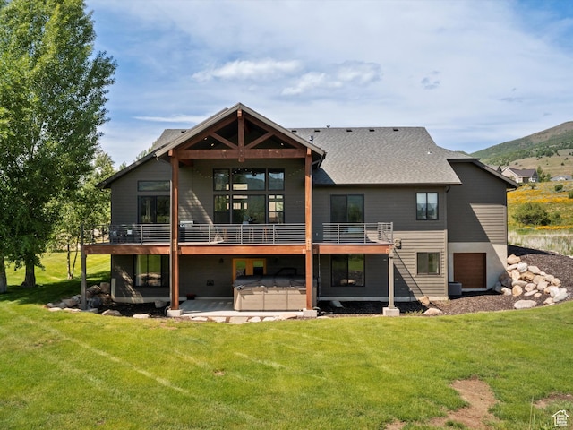 4021 E 4325 N, Eden, UT 84310 - back of house featuring a covered hot tub, a yard, a patio, and a deck with mountain view
