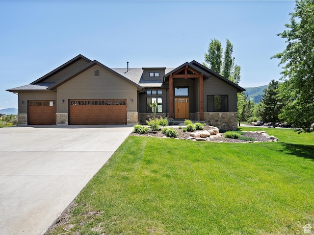 4021 E 4325 N, Eden, UT 84310 - view of front of home with stone siding, a garage, and a front lawn