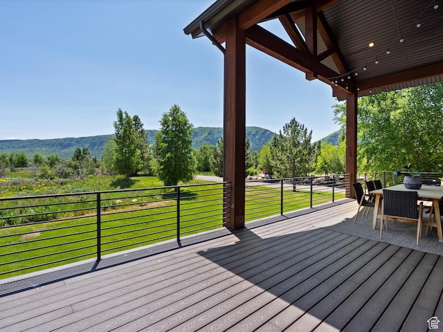 4021 E 4325 N, Eden, UT 84310 - wooden terrace with a mountain view, outdoor dining space, and a lawn