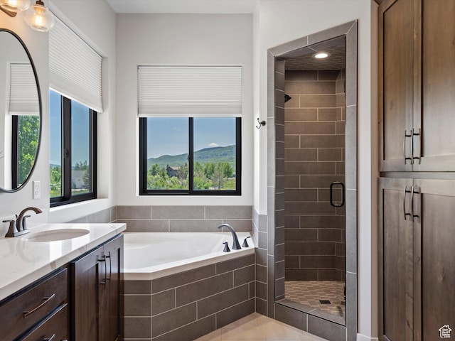 4021 E 4325 N, Eden, UT 84310 - bathroom with vanity, a stall shower, healthy amount of natural light, and a garden tub