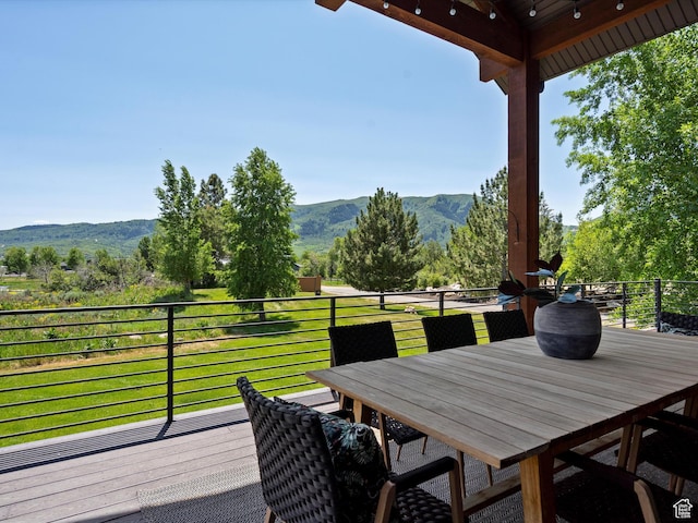 4021 E 4325 N, Eden, UT 84310 - wooden deck featuring a mountain view and outdoor dining space