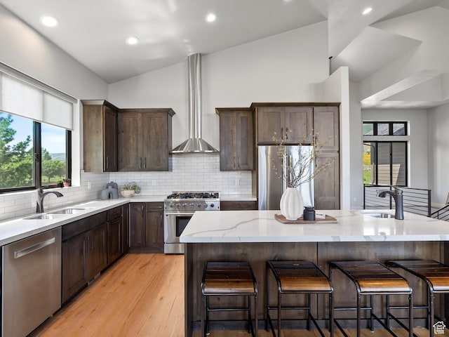 4021 E 4325 N, Eden, UT 84310 - kitchen with stainless steel appliances, a sink, lofted ceiling, wall chimney exhaust hood, and light stone counters