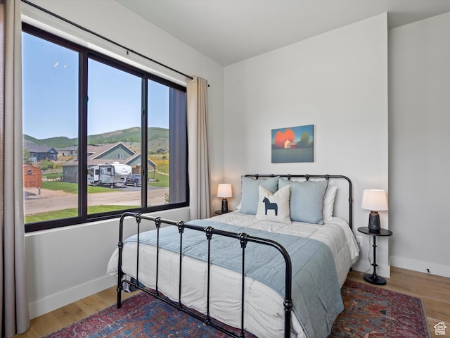 4021 E 4325 N, Eden, UT 84310 - bedroom with wood finished floors and baseboards
