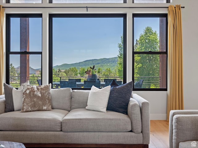 4021 E 4325 N, Eden, UT 84310 - living area featuring wood finished floors, a mountain view, and baseboards