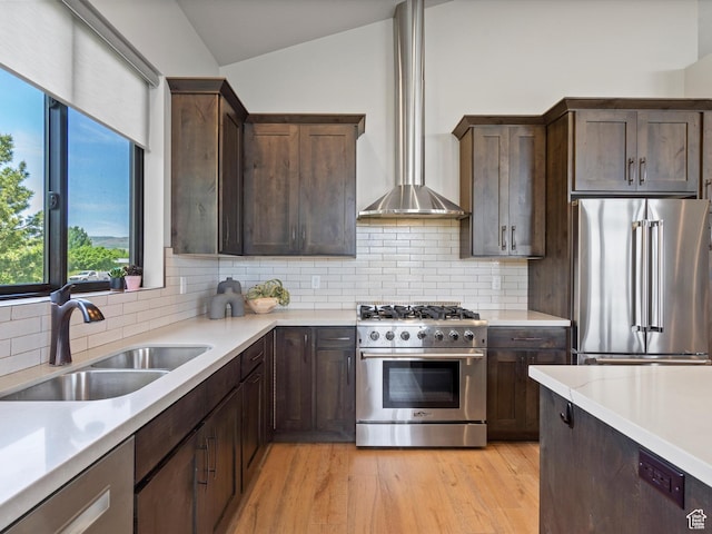 4021 E 4325 N, Eden, UT 84310 - kitchen featuring high quality appliances, wall chimney exhaust hood, a sink, vaulted ceiling, and light countertops
