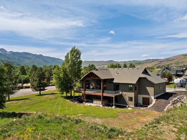 4021 E 4325 N, Eden, UT 84310 - back of property with a deck with mountain view, a yard, and roof with shingles