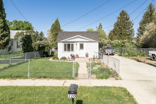 220 S 2nd E, Soda Springs, ID 83276 - bungalow-style home with a gate, concrete driveway, and roof with shingles