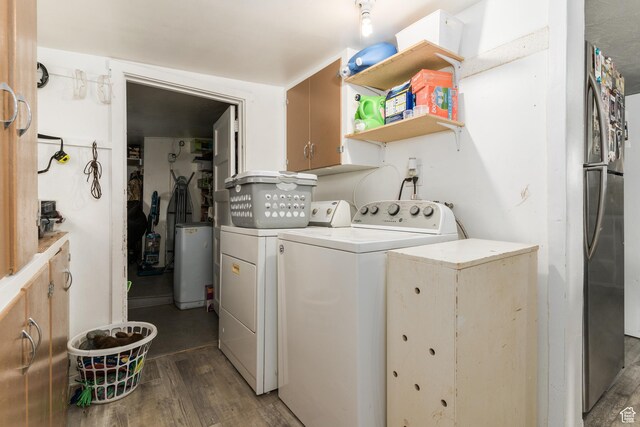 220 S 2nd E, Soda Springs, ID 83276 - washroom featuring washing machine and clothes dryer, wood finished floors, and cabinet space