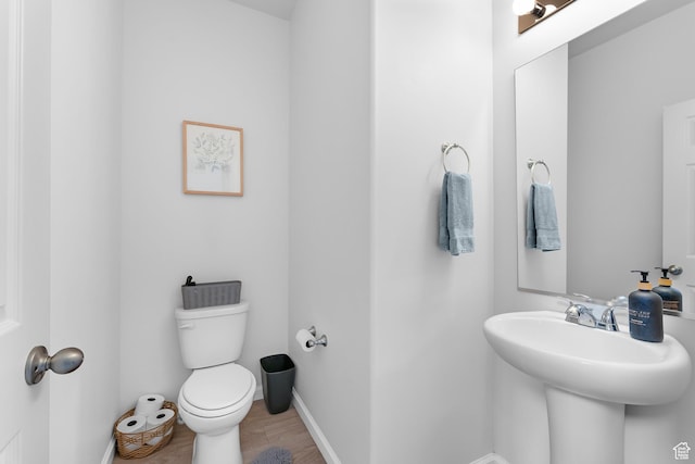 227 E Sandhill Dr, Saratoga Springs, UT 84045 - bathroom with toilet, wood finished floors, and baseboards