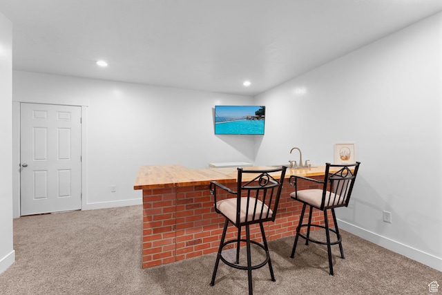 227 E Sandhill Dr, Saratoga Springs, UT 84045 - carpeted dining area featuring wet bar, baseboards, and recessed lighting