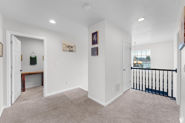 227 E Sandhill Dr, Saratoga Springs, UT 84045 - corridor with carpet flooring, baseboards, recessed lighting, and a chandelier