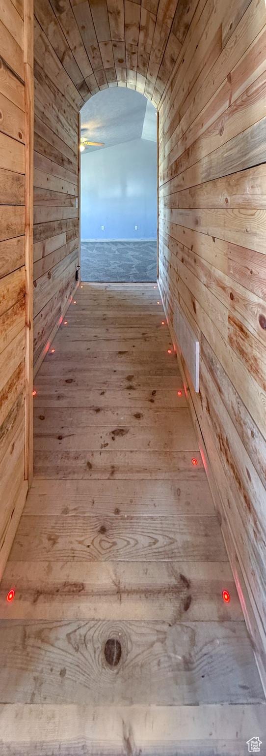 121 2nd W, East Carbon, UT 84520 - hall featuring wooden walls, wood-type flooring, and vaulted ceiling