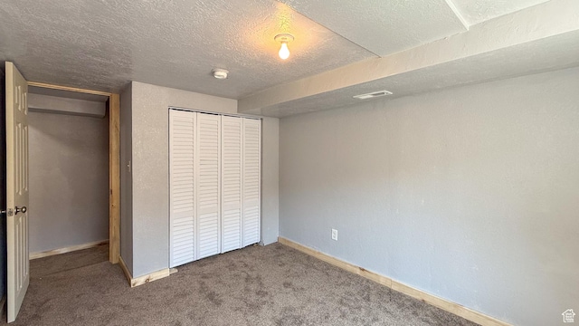 121 2nd W, East Carbon, UT 84520 - unfurnished bedroom with a closet, carpet floors, and a textured ceiling