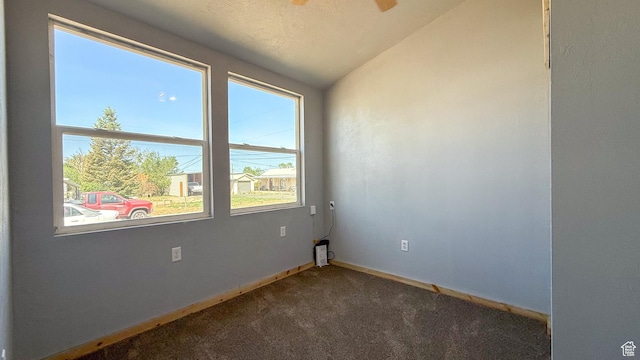 121 2nd W, East Carbon, UT 84520 - empty room featuring dark carpet and lofted ceiling