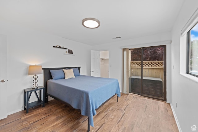 480 S 200 W Unit 6, St George, UT 84770 - bedroom featuring access to exterior, wood finished floors, and baseboards