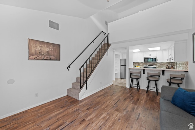 480 S 200 W Unit 6, St George, UT 84770 - living area with dark wood-style flooring, baseboards, and stairs
