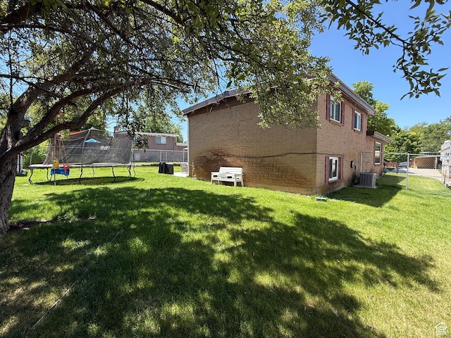 4350 S 850 E, South Ogden, UT 84403 - view of side of property featuring a trampoline and brick siding
