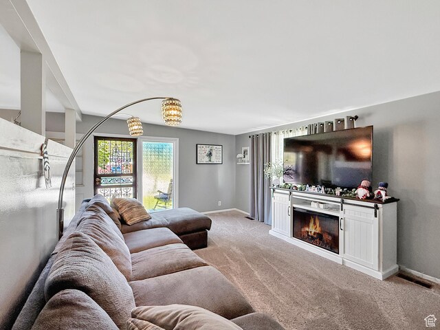 4350 S 850 E, South Ogden, UT 84403 - living area featuring light colored carpet, a warm lit fireplace, and baseboards
