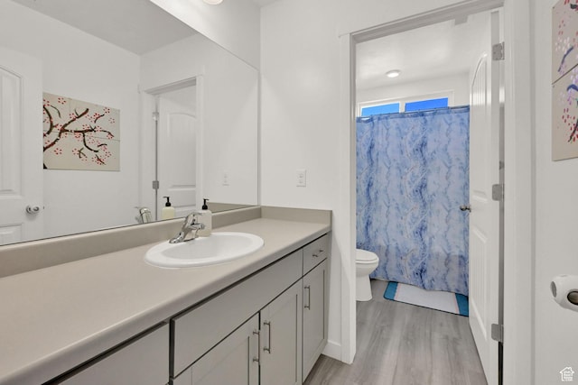 8498 N Colette St, Lake Point, UT 84074 - bathroom featuring toilet, vanity, and wood finished floors