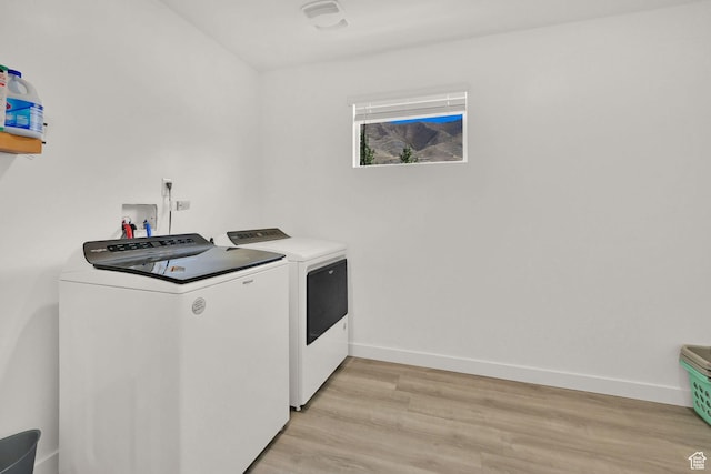8498 N Colette St, Lake Point, UT 84074 - laundry room with independent washer and dryer, light wood-style flooring, and baseboards