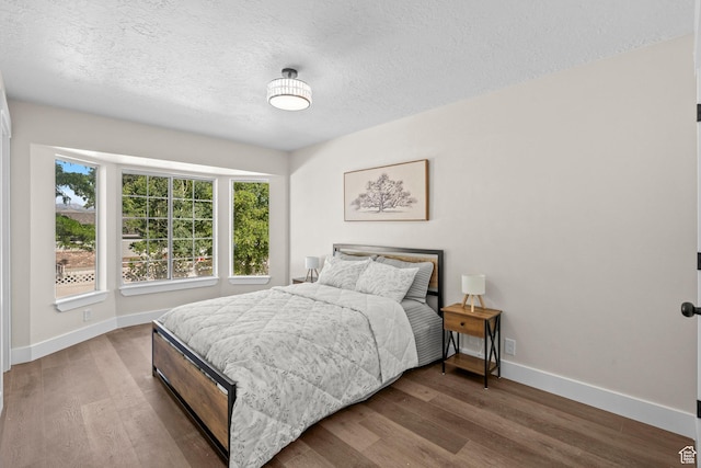 2139 N 300 W, Lehi, UT 84043 - bedroom featuring baseboards, wood finished floors, and a textured ceiling