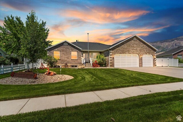 2656 Remuda Dr, Farr West, UT 84404 - ranch-style home with an attached garage and driveway