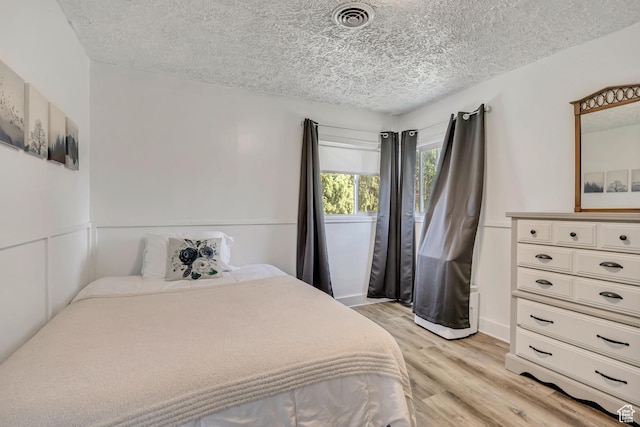 232 E 5900 S, Murray, UT 84107 - bedroom featuring light wood-style floors and a textured ceiling