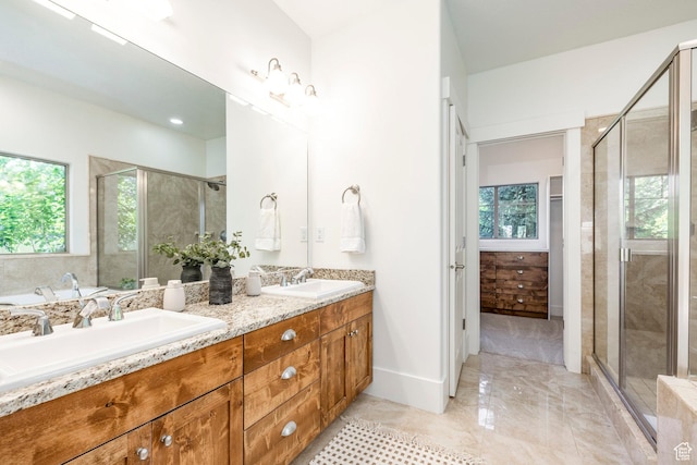 5865 Belmont Dr, Mountain Green, UT 84050 - bathroom with double vanity, a stall shower, and baseboards