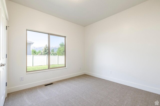 5865 Belmont Dr, Mountain Green, UT 84050 - spare room with light colored carpet and baseboards