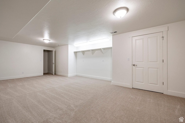 5865 Belmont Dr, Mountain Green, UT 84050 - finished basement featuring light carpet, baseboards, and a textured ceiling