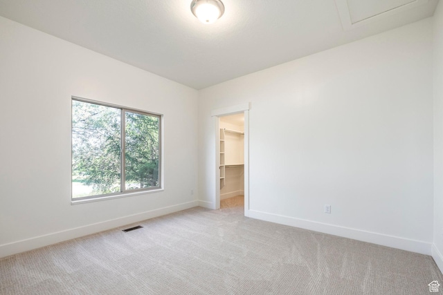 5865 Belmont Dr, Mountain Green, UT 84050 - spare room featuring baseboards, light colored carpet, and attic access
