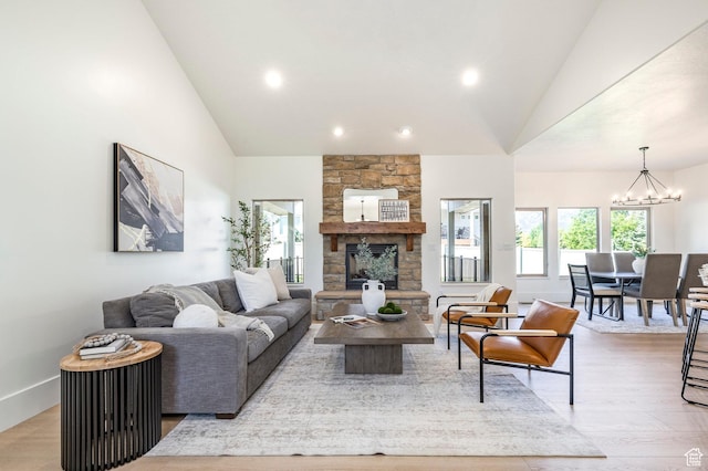 5865 Belmont Dr, Mountain Green, UT 84050 - living area featuring a chandelier, light wood-style flooring, a fireplace, recessed lighting, and baseboards