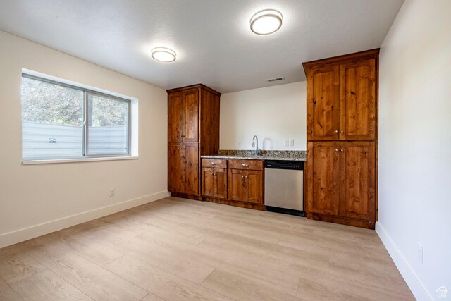 5865 Belmont Dr, Mountain Green, UT 84050 - kitchen featuring stainless steel dishwasher, light wood finished floors, baseboards, and brown cabinets