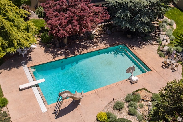 13966 S Arrow Creek Dr E, Draper, UT 84020 - outdoor pool featuring a water slide, a diving board, and a patio area