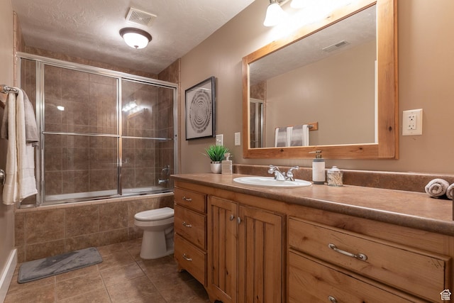 13966 S Arrow Creek Dr E, Draper, UT 84020 - bathroom with tiled shower / bath combo, vanity, toilet, and tile patterned floors